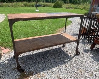 Early Industrial wood top rolling 5’ table with wood shelf 