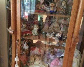 Antique oak china with doll collection