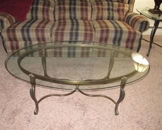 Three cushioned sofa, glass top coffee table with two matching glass top side table.  Two burgundy lamps