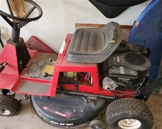 Toro, mower, garden tractor, with baggers . Needs battery.  Needs tune up 
