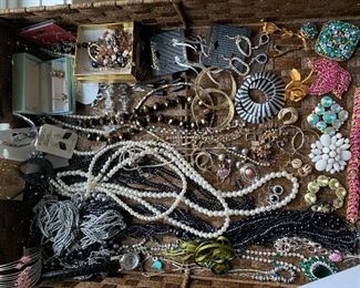 24. Jewelry and contents of top of shelf $75