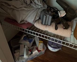 28. three bottom shelves, mostly bathroom items $20