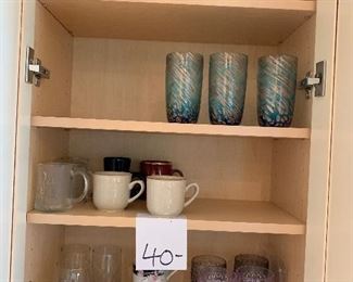 40. Cabinet mugs, casserole $10