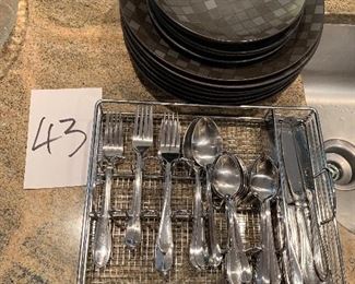 43. Black dishes and silverware $35