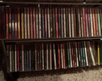 97. CD/ DVD rack with over 200 rock and alternative CDs $150