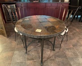 107 2 chairs and a solid tile table $150.                                  36" diameter x 31" tall - chairs 24" x 21" x 38" tall 