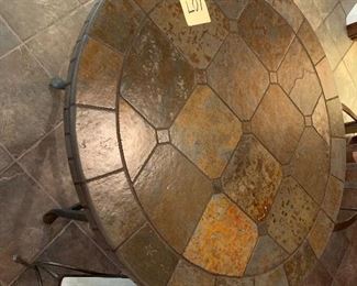 107 2 chairs and a solid tile table $150                                    36" diameter x 31" tall - chairs 24" x 21" x 38" tall 