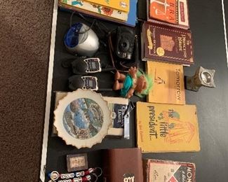 129. Misc books & stuff on ping pong table $20