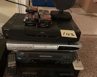 143. Set fo 4 Video players, including a 2 tape deck, DVD player and VHS, antenna and some sealed TDK Cassette tapes. $50 all
