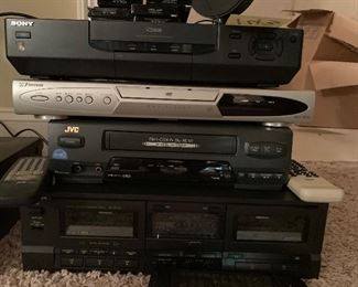 143. Set fo 4 Video players, including a 2 tape deck, DVD player and VHS, antenna and some sealed TDK Cassette tapes. $50 all
