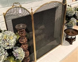 One of two textured tall candle holders