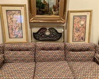 3-cushion sofa; array of art