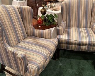 A pair of wingback chairs