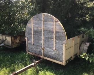 Wood trailer near back of property.  If interested, ask staff for assistance.