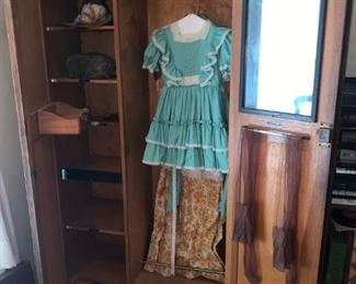 Interior of Awesome Antique Armoire with Vintage Clothes 