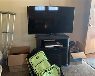 Variety of Ace Bandage wraps.  Crutches.  3 piece luggage set.  49 in Samsung Smart TV.  SV2000 DVD Recorder.