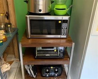 Hamilton Beach crock pot and microwave.   Black and Decker toaster oven.  Sunbeam 4 slice toaster.  Proctor Silex Iron.