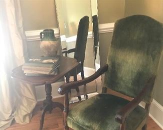 Antique English walnut chair with green velvet upholstery.  
Lovely inlay mahogany tilt-top table.
French olive jar.
Travel books.