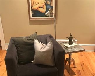 Dark grey swivel boxed arm club chair.

Brazilian original painting...Madonna and child...cubist style.