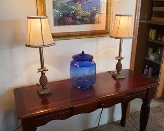 Entry/Buffet Table, Brass Pineapple Lamps, Cobalt Blue Jar with Lid.  Framed Print. 