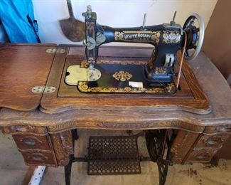 Antique White Sewing Machine with Treadle. Machine is in really good shape. Case needs oiling and love. 