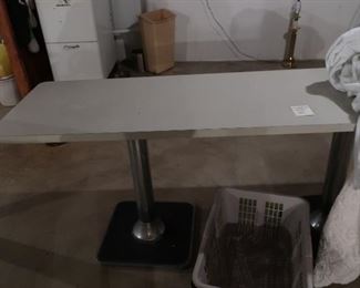 long  table  with two  metal  bases-  table  is 1' 11" deep  and  6'1"  in  length