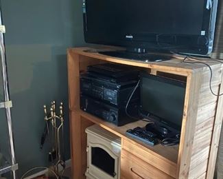 Phillips Smart TV / Computer Desk / Sony Vintage Working Stereo / Electric Heater In The Fashion Of A Fire Place / Fire Place Set / Quick Start Packaged Wood / Countertop 20" TV 