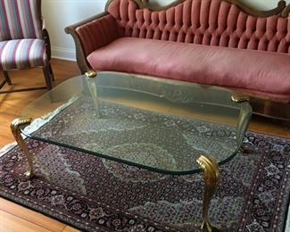 Vintage brass and glass coffee table and antique sofa