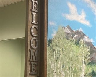 Wall mounted welcome sign