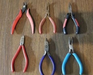 6 pair of small snips and needle nose pliers