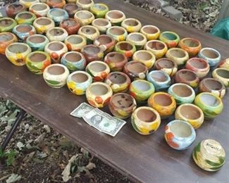 approximately 65 small Mexican pots. Hole in bottom