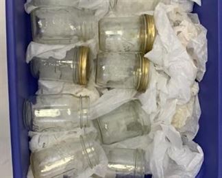 mason jars in plastic bin