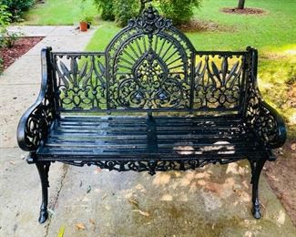 LATE VICTORIAN CAST IRON GARDEN BENCH IN THE COALBROOKDALE 'PEACOCK' PATTERN. Sculpted arm rests, an arched backrest, and a slatted seat. A unique and comfortable design with excellent detail throughout. Dimensions: 39"H x 46-1/2"L x 22"D