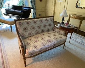19th century French parcel gilt settee with reproduction silk upholstery