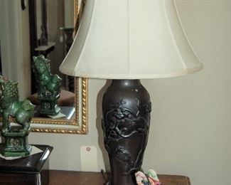 Staffordshire figurine and pottery lamp