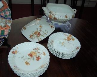 Floral dinner plates and covered bowl by Limoges