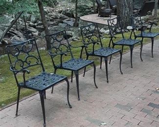 Set of five black iron chairs