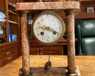 Antique clock with lion embellishment