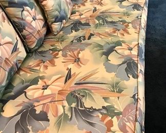 This sofa with its bold and warm design would do well in a large room. It's in good condition and very comfortable. No Stains. Comes with throw pillows.