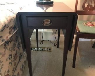 A Vintage 1990's Mahogany Pembroke Table. Dovetailed drawer construction. Good Condition. Each flap is 8.75 inches. Fun fact: A Pembroke table is a drop-leaf table designed for light use. The name Pembroke came from Henry Herbert, 9th Earl of Pembroke (1693-1751) He was a noted connoisseur and amateur architect.