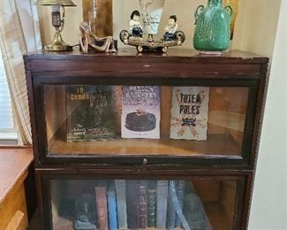 classic glass front bookcase MCM lamps and great book collection