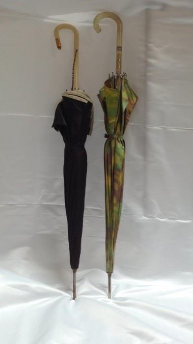 https://connect.invaluable.com/randr/auction-lot/2-retro-umbrellas-1950s-double-layered-umbrella_8064DF4964