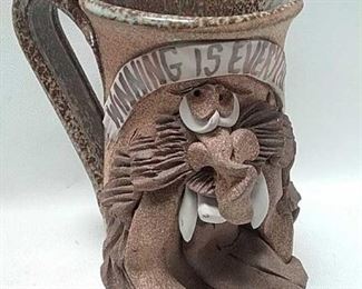 https://connect.invaluable.com/randr/auction-lot/vintage-stoneware-ugly-face-mug-winning-is_12D4C9797D