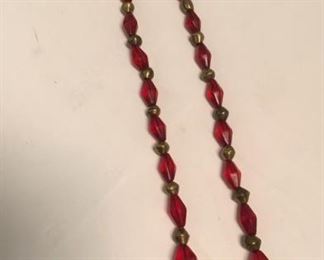 https://connect.invaluable.com/randr/auction-lot/c1800s-red-and-brass-trade-beads_DA64BD1A8C