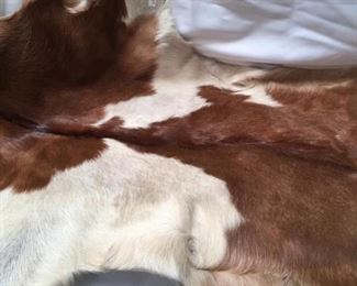 https://connect.invaluable.com/randr/auction-lot/35-brown-white-calfskin-cowhide-rug_AD749BBB3E