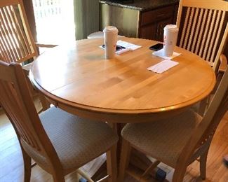 Round Kitchen Table with 4 chairs, has leaf 