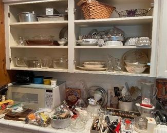 Huge kitchen loaded with small appliances, vintage and current items.
