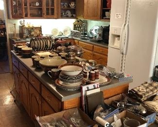 Tons of western dishes and 2 door refrigerator.