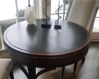 https://refined-north-shore.myshopify.com/products/round-game-table-with-black-leather-top-damage-to-leather