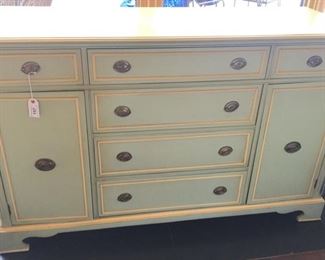 Painted green and yellow wooden chest with brass handles